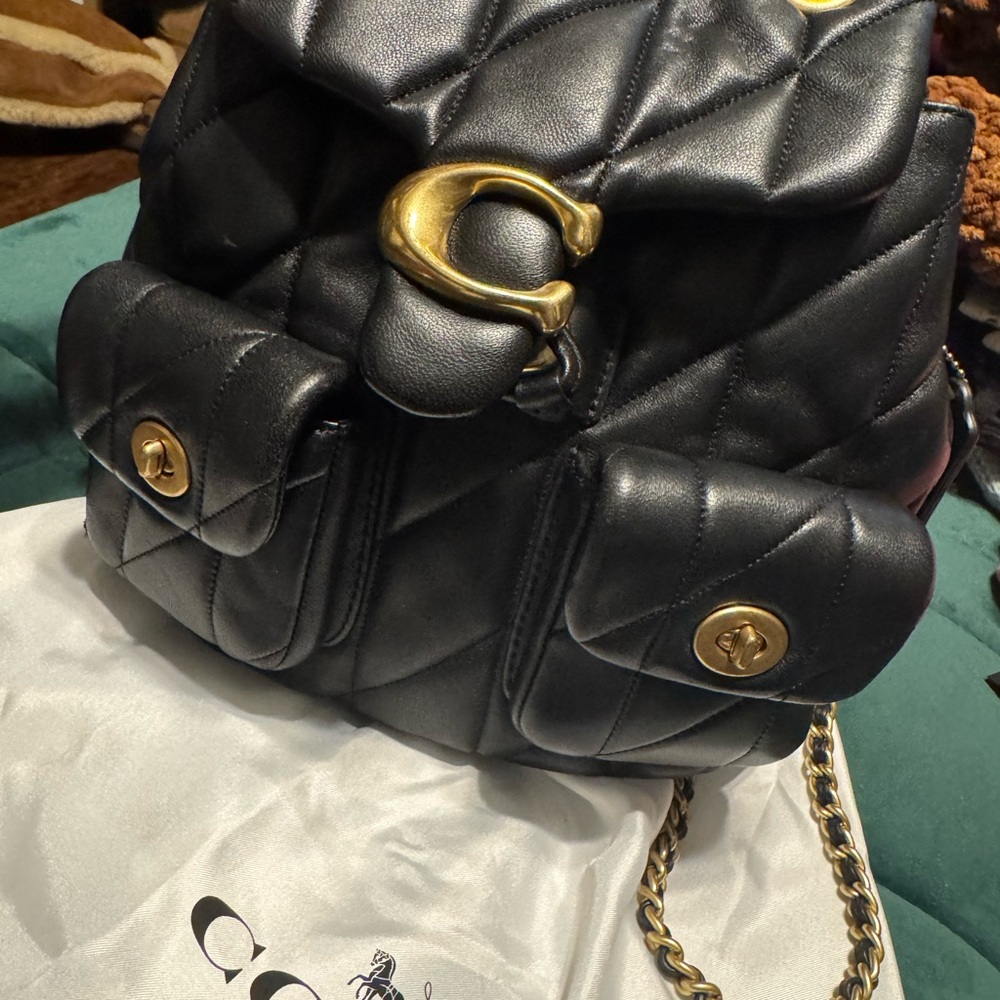 Authentic worn twice Coach Black tabby quilted backpack w/ dustbag.